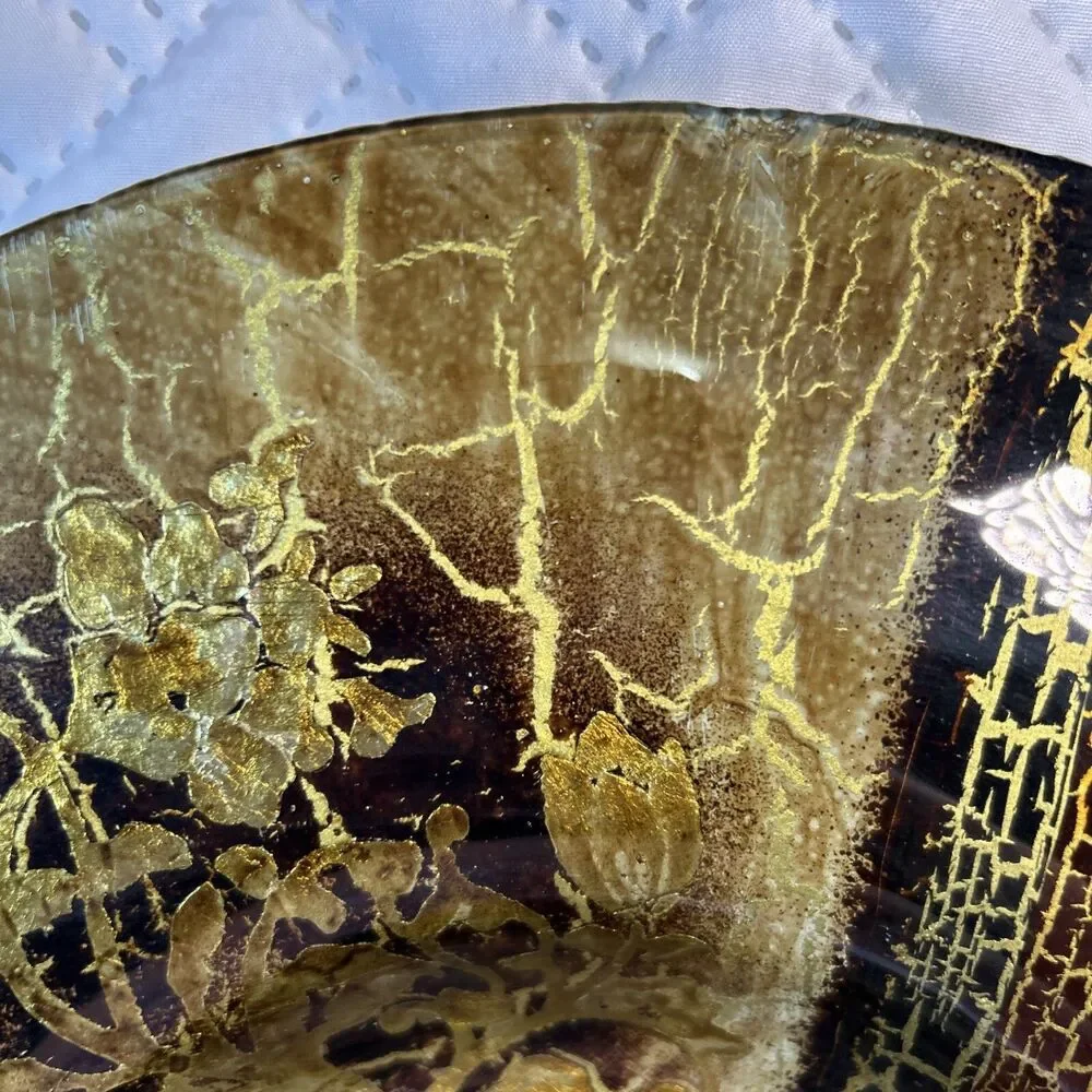 Glass bowl features an asymmetrical shape with a striking black and gold crackle